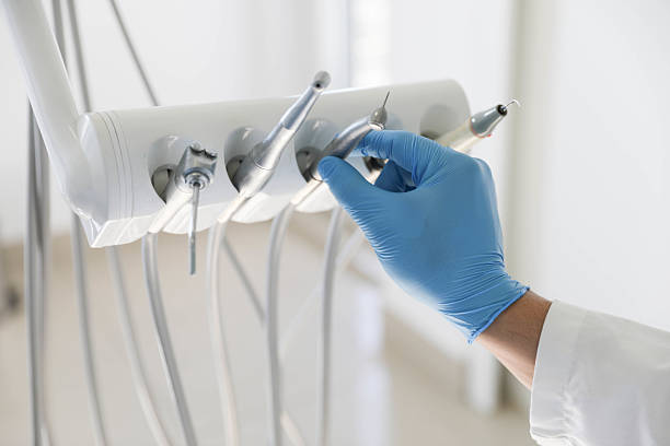 Professional Tooth Extraction technician working in Louisville, OH